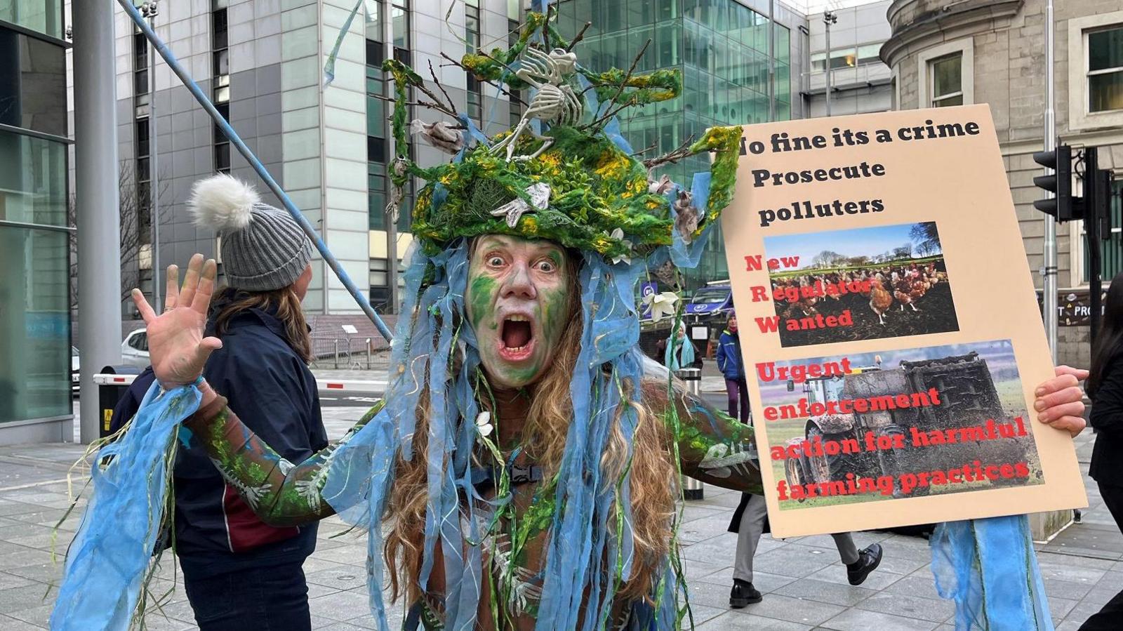 Protestor wearing costume outside court