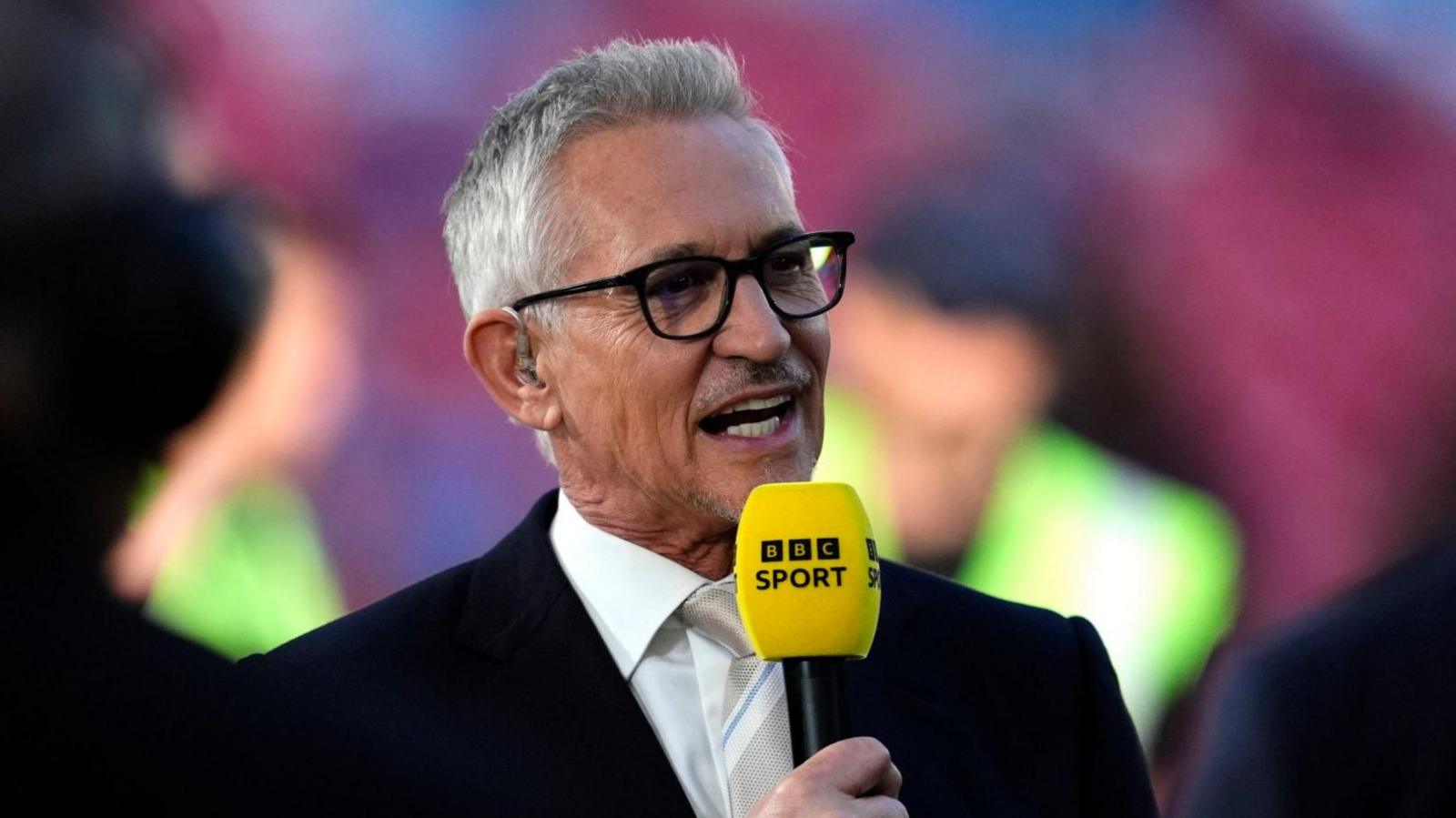 Lineker holding BBC Sport microphone