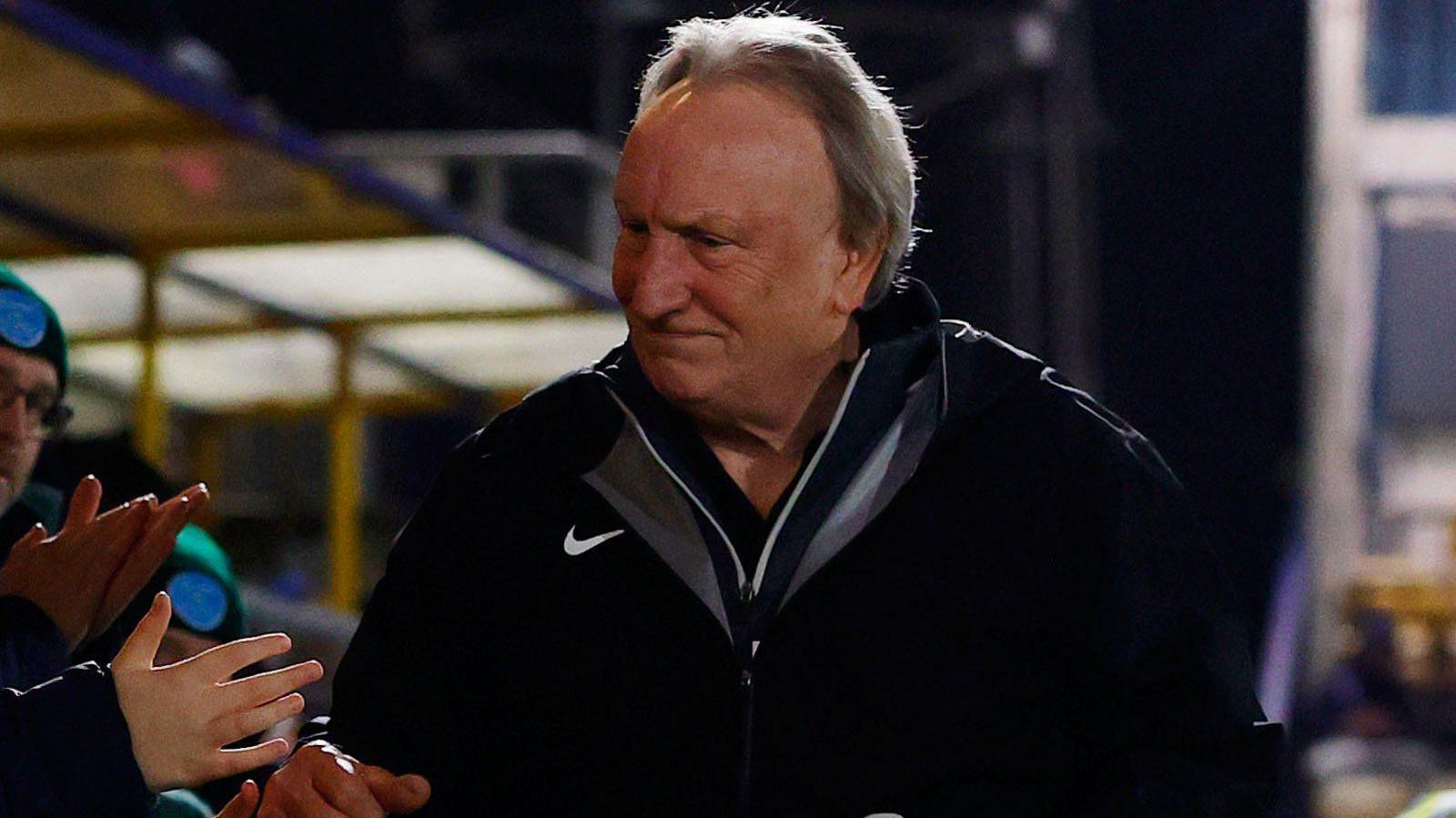 Neil Warnock greets the Torquay fans at Plainmoor