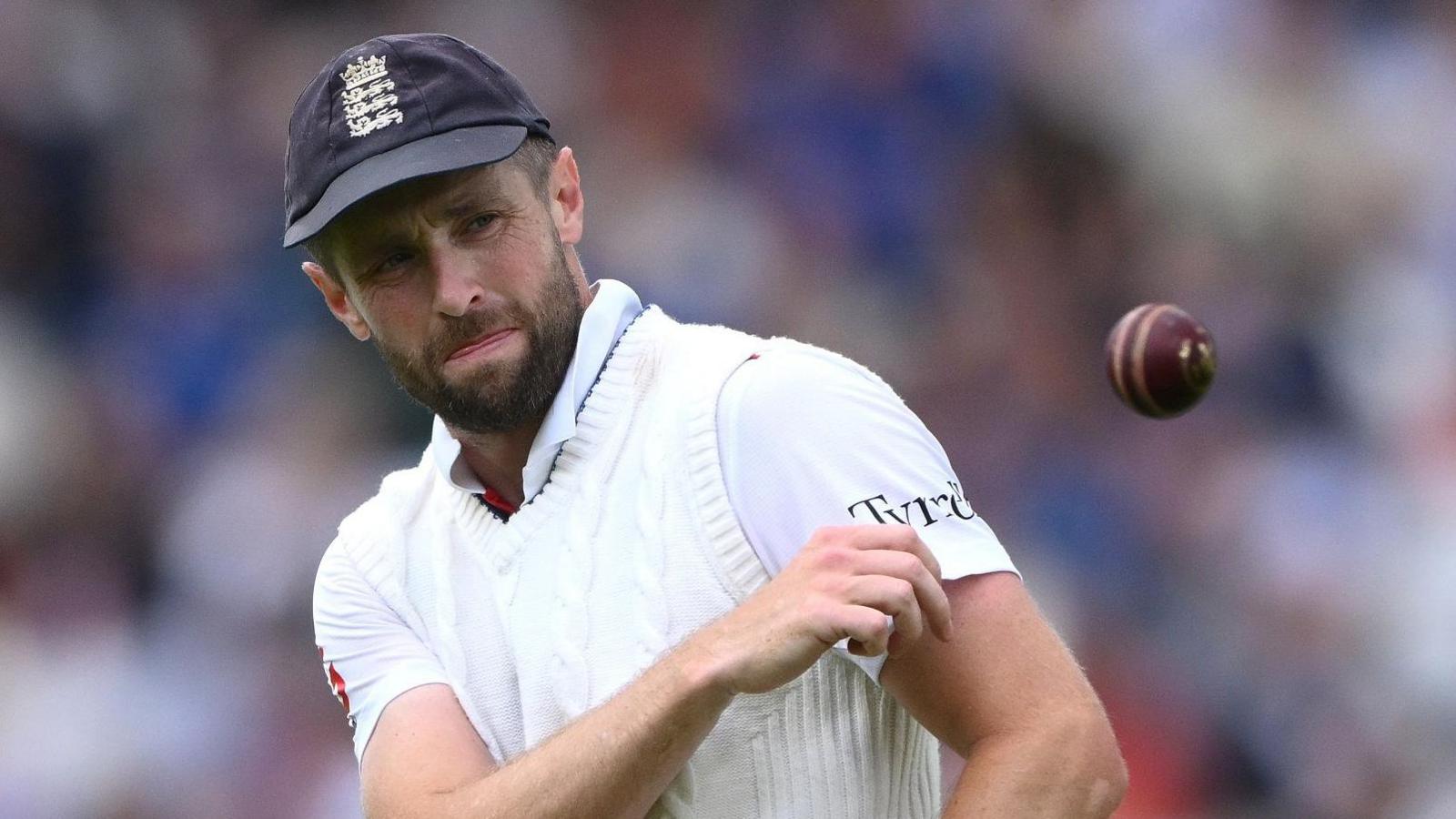 Chris Woakes throwing a cricket ball while playing for England