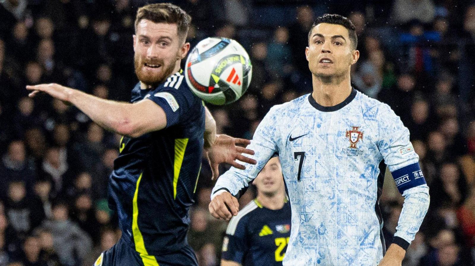 Scotland's Anthony Ralston and Portugal’s Cristiano Ronaldo during a UEFA Nations League Group A1 match between Scotland and Portugal at Hampden Park