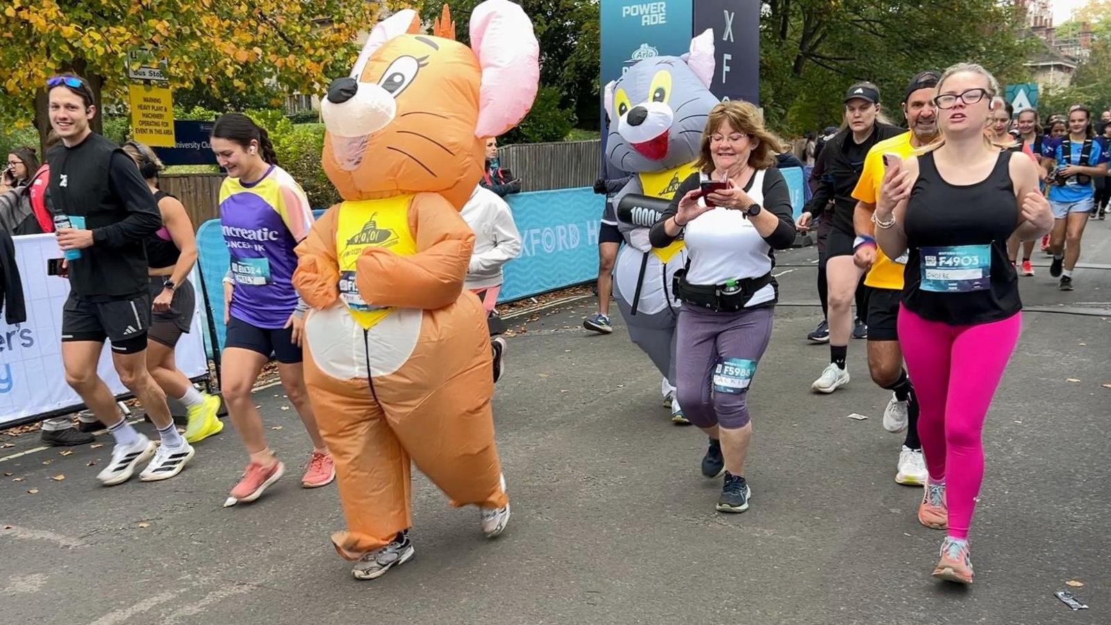 Two people dressed as Tom and Jerry take part in the Oxford Half.