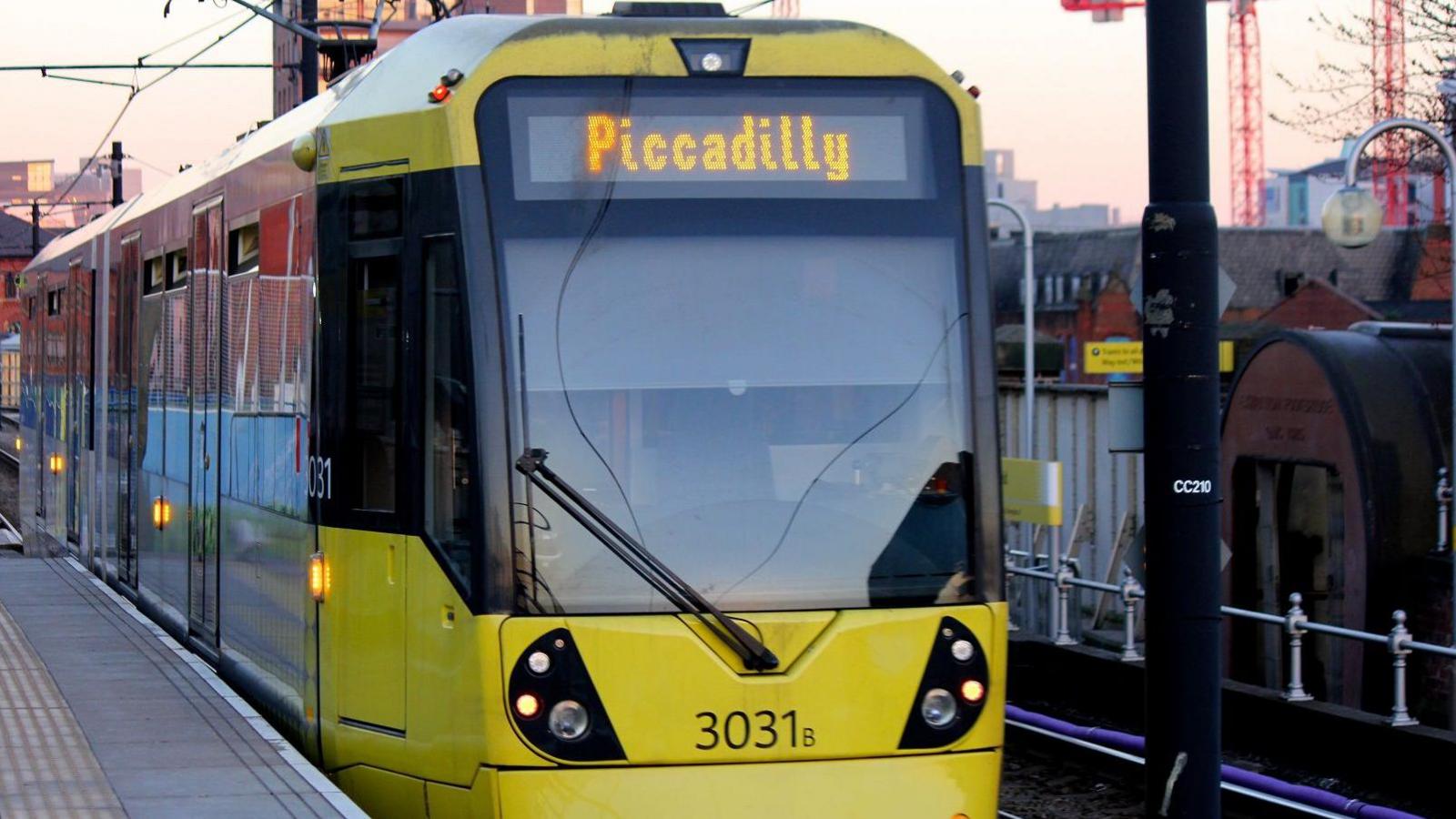 stock image of yellow tram with Piccadilly signage on the front 