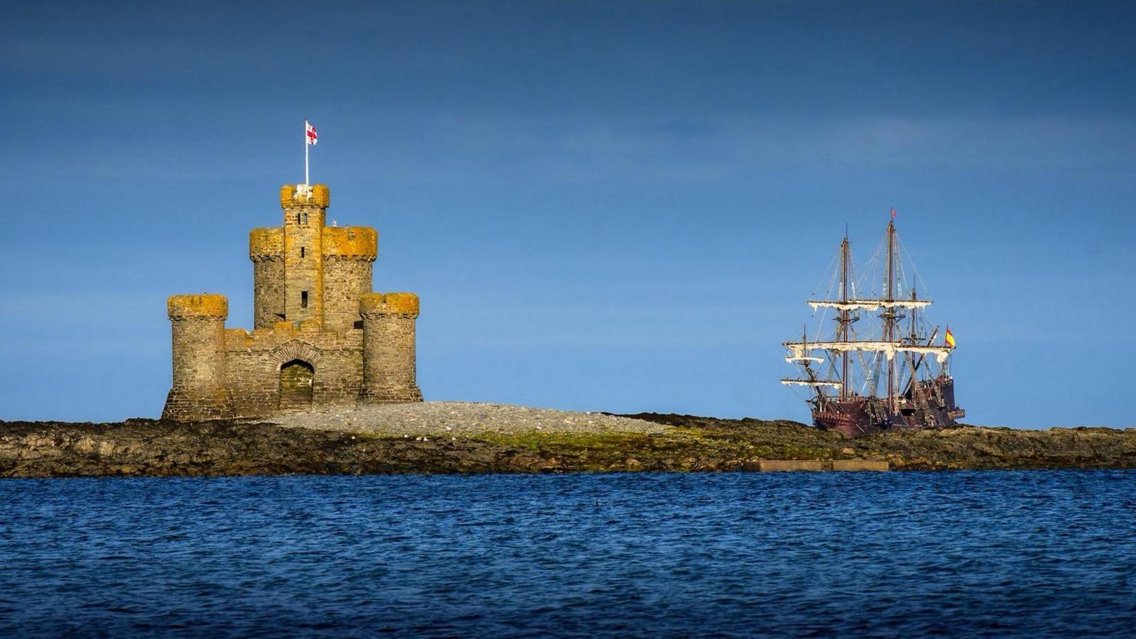 The Tower of Refuge is on the left, on the right you can see the old ship in the background.