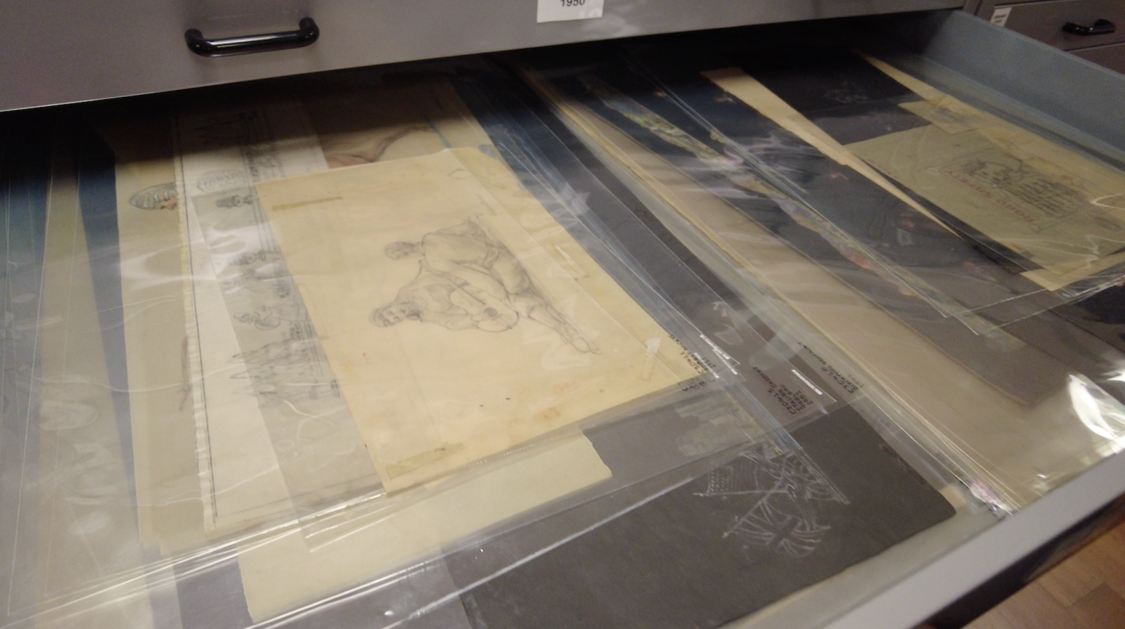 A drawer full of hand drawn pencil designs of Illuminations from the 1950s.