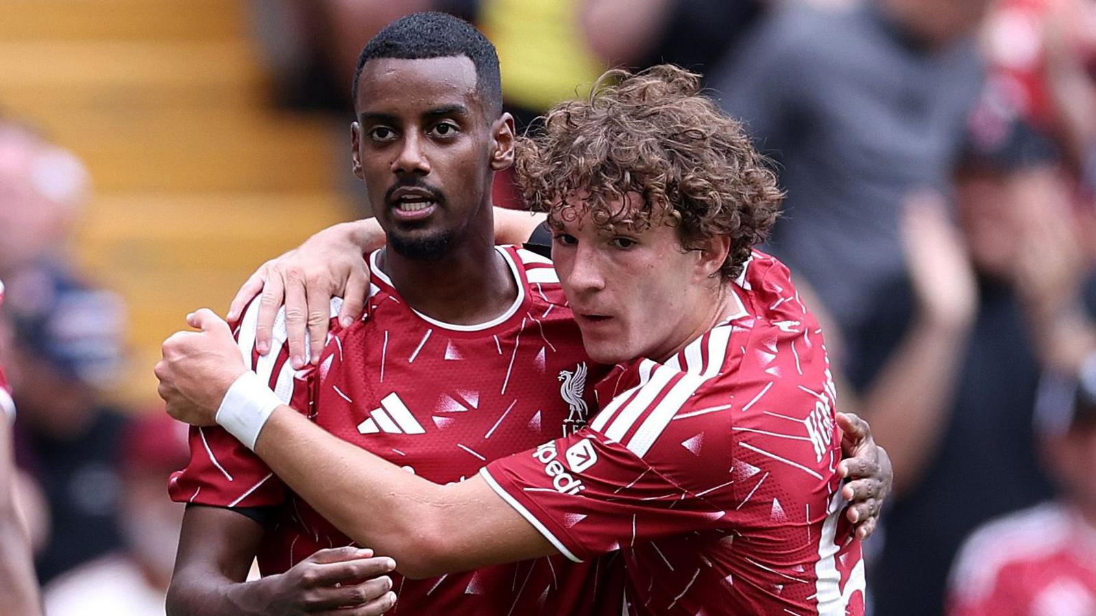 Alexander Isak celebrates with Liverpool team-mate Lewis Koumas