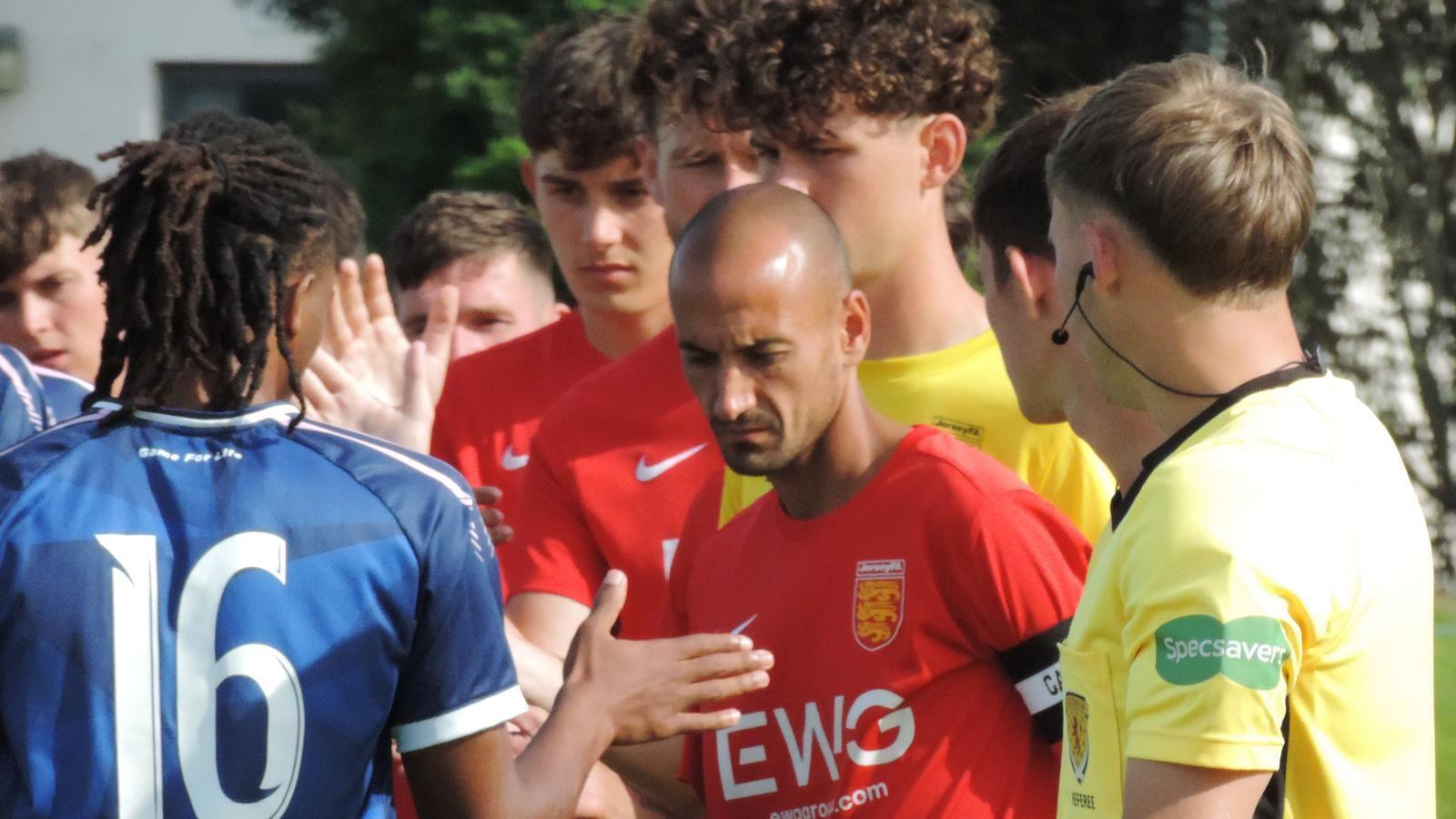 Jersey captain Karl Hinds leads out his side