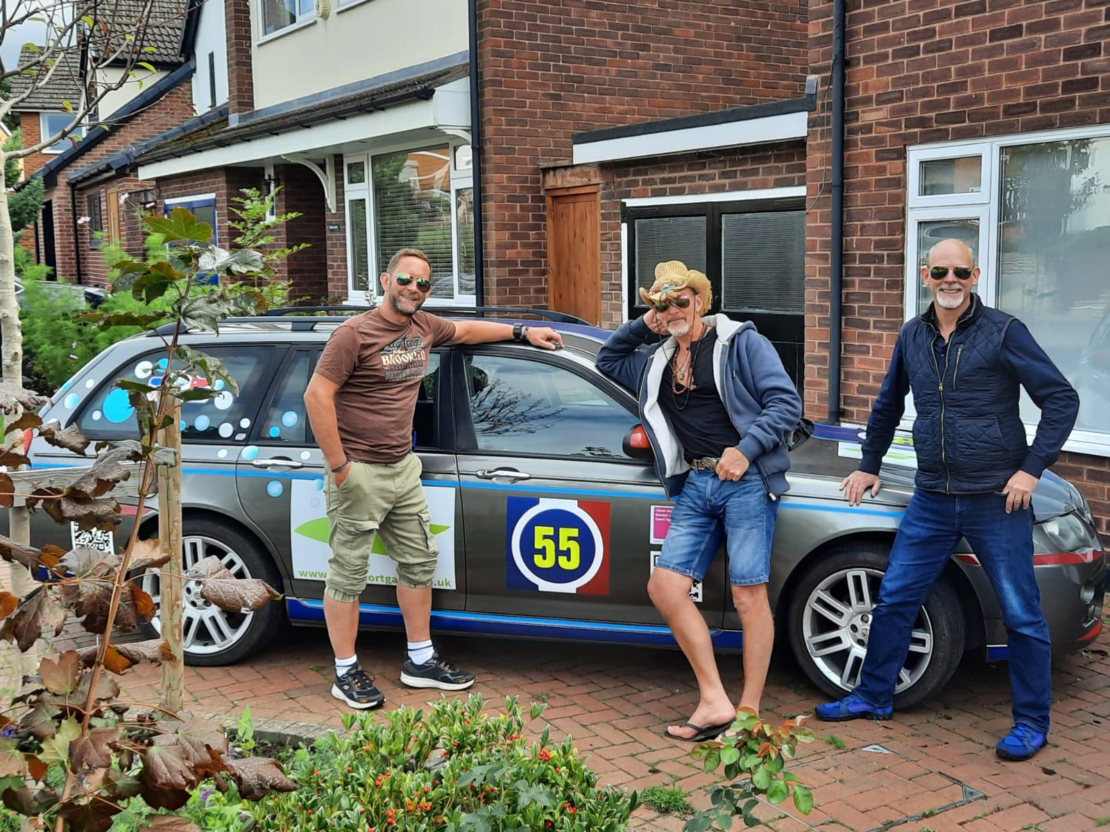 The three brothers with their car