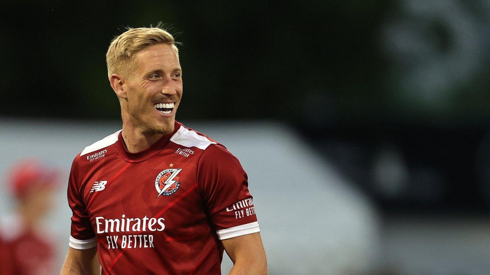 Luke Wood smiles while playing for Lancashire