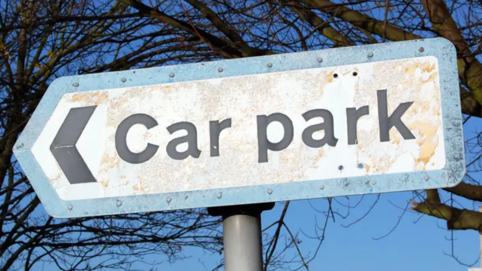 A sign which reads 'Car Park'.