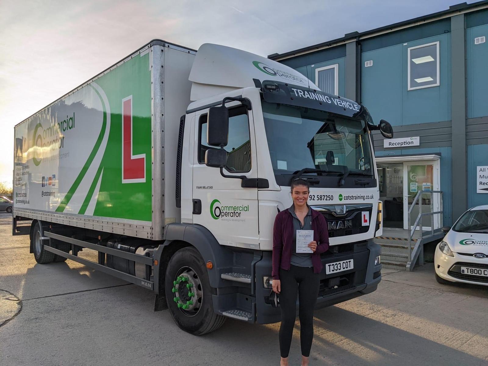 Katie Jones next to a HGV