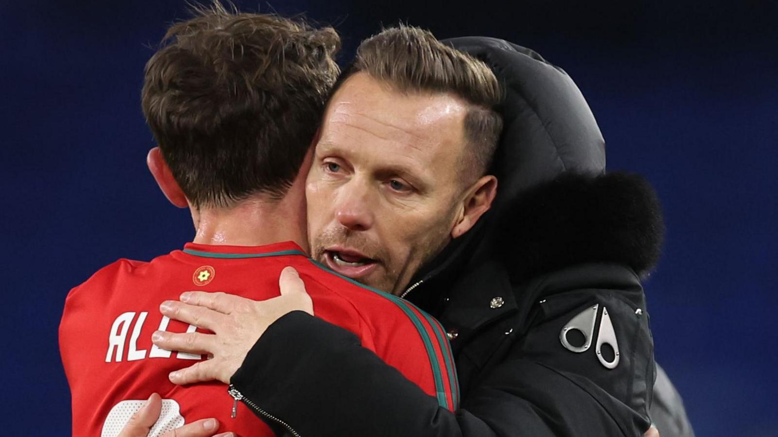 Craig Bellamy embraces Joe Allen as Wales celebrate beating Iceland