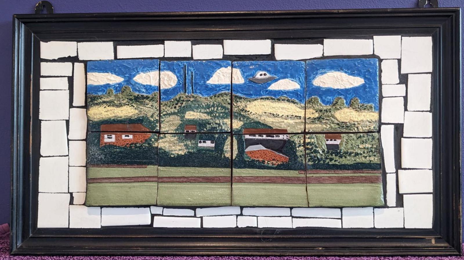 Ceramic tiles depicting the Staffordshire countryside with a UFO flying in the sky