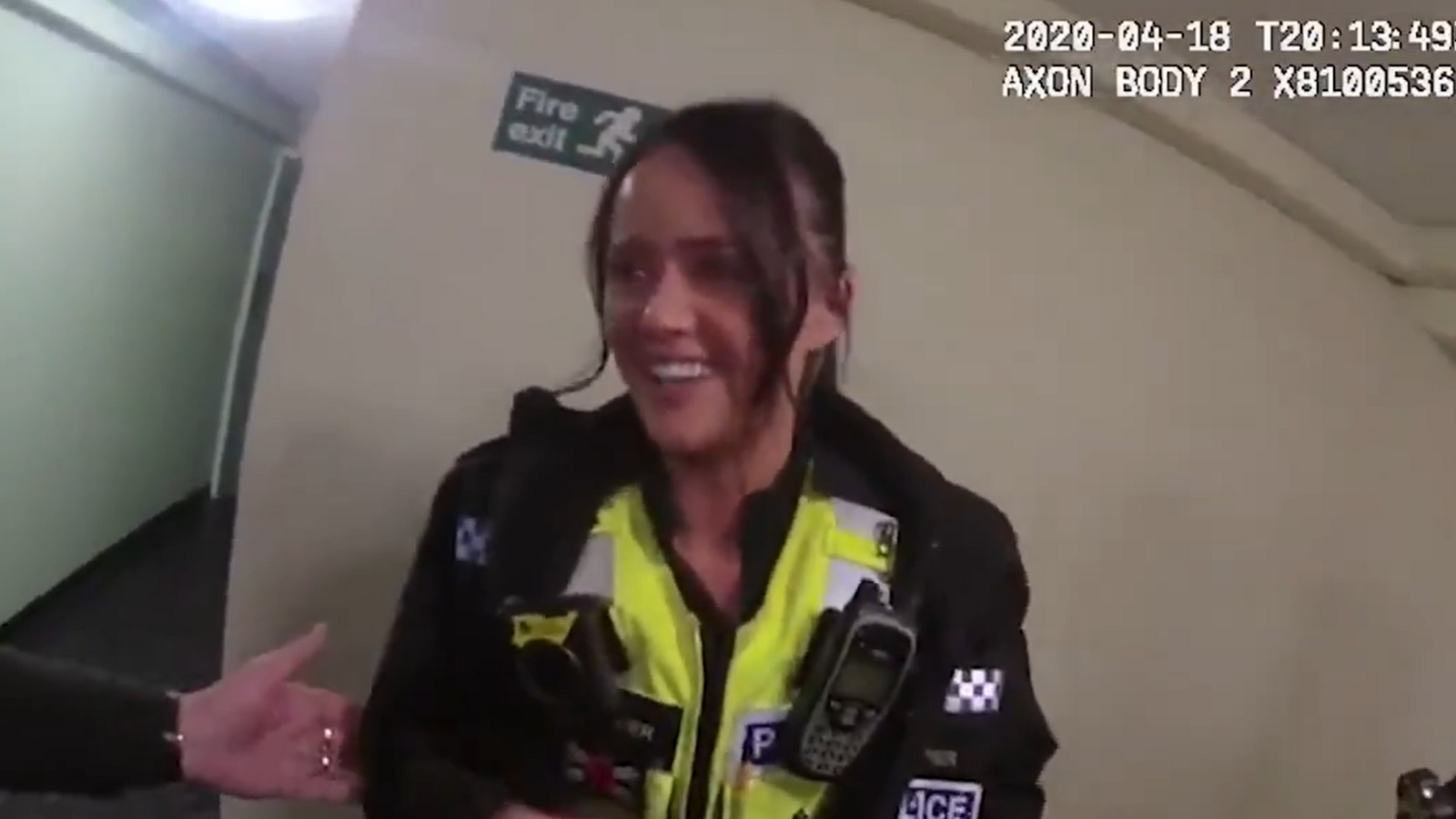 Bodycam footage showing Annie Napier, dressed in police uniform smiling at someone off-screen