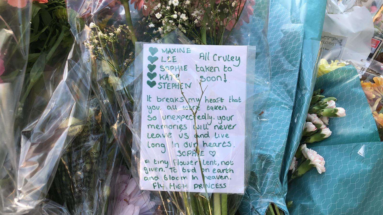 Tribute message for victims on flowers