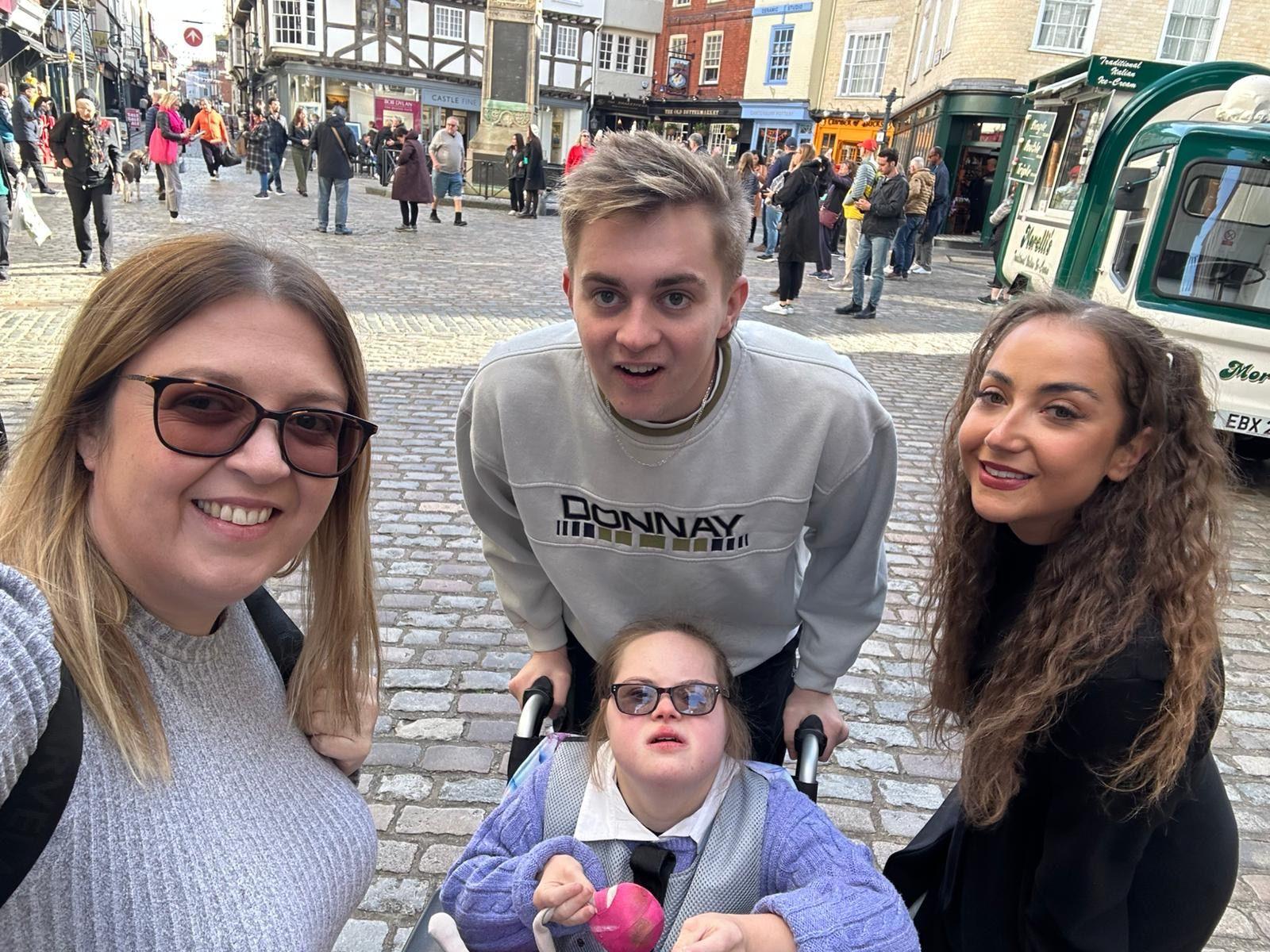 Emily taking a selfie with her daughter Keira, son Ryan and her sister