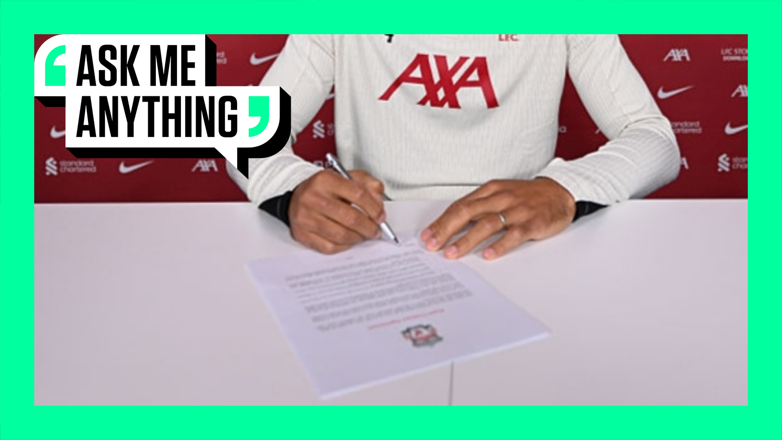 Liverpool player signing a contract