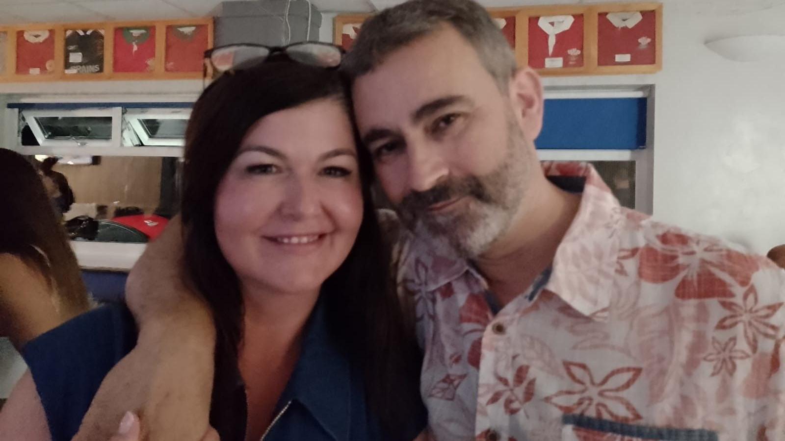 Ciaran's parents Hayley and Mark, with their arms around each other, at Tondu RFC