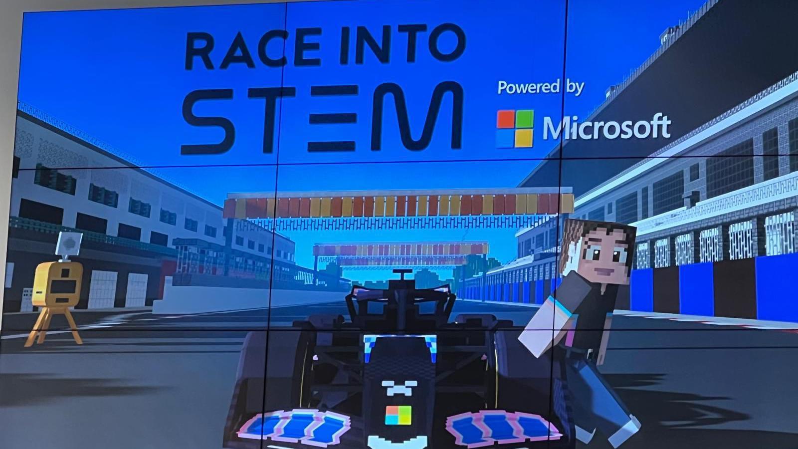 A TV screen with the words 'Race into STEM' above a formula one car and a person both in the world of minecraft.