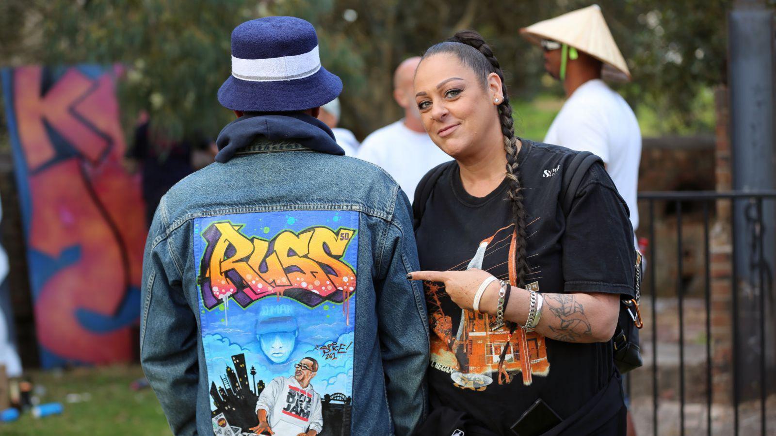 Spice points to a graffiti art jacket that says Russ