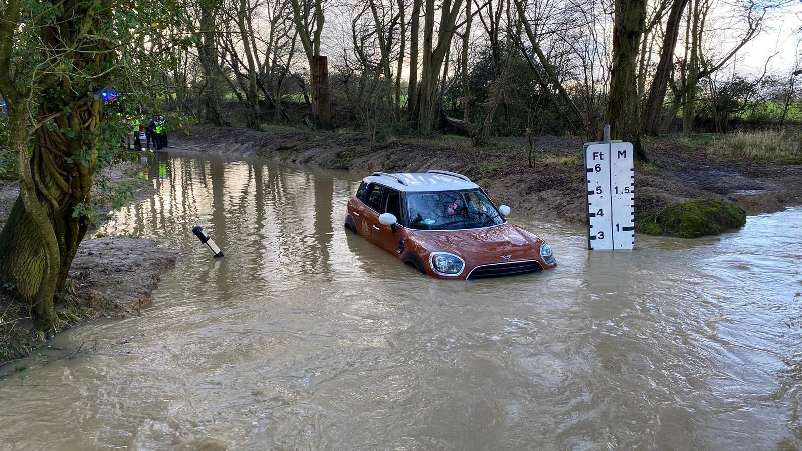 Mini car covered by floodwater