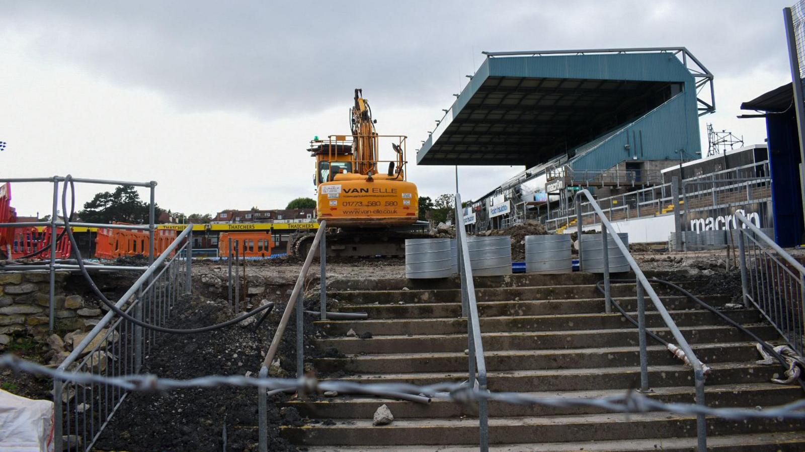 The Memorial Stadium in Bristol showing a digger at work on a new stand