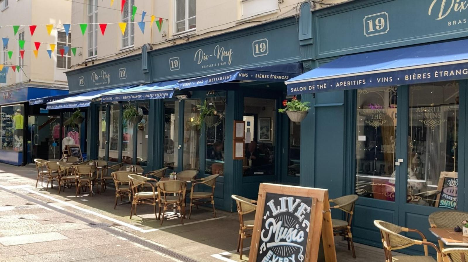 Empty chairs outside Dix-Neuf resturant