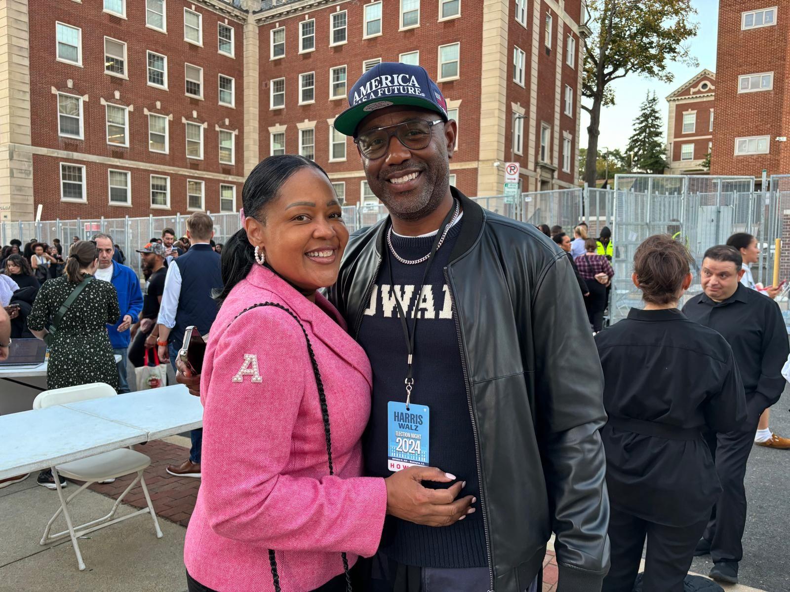 Cheryl Taylor in a pink AKA sorority jacket, seen with fellow alum Lewis Long. 