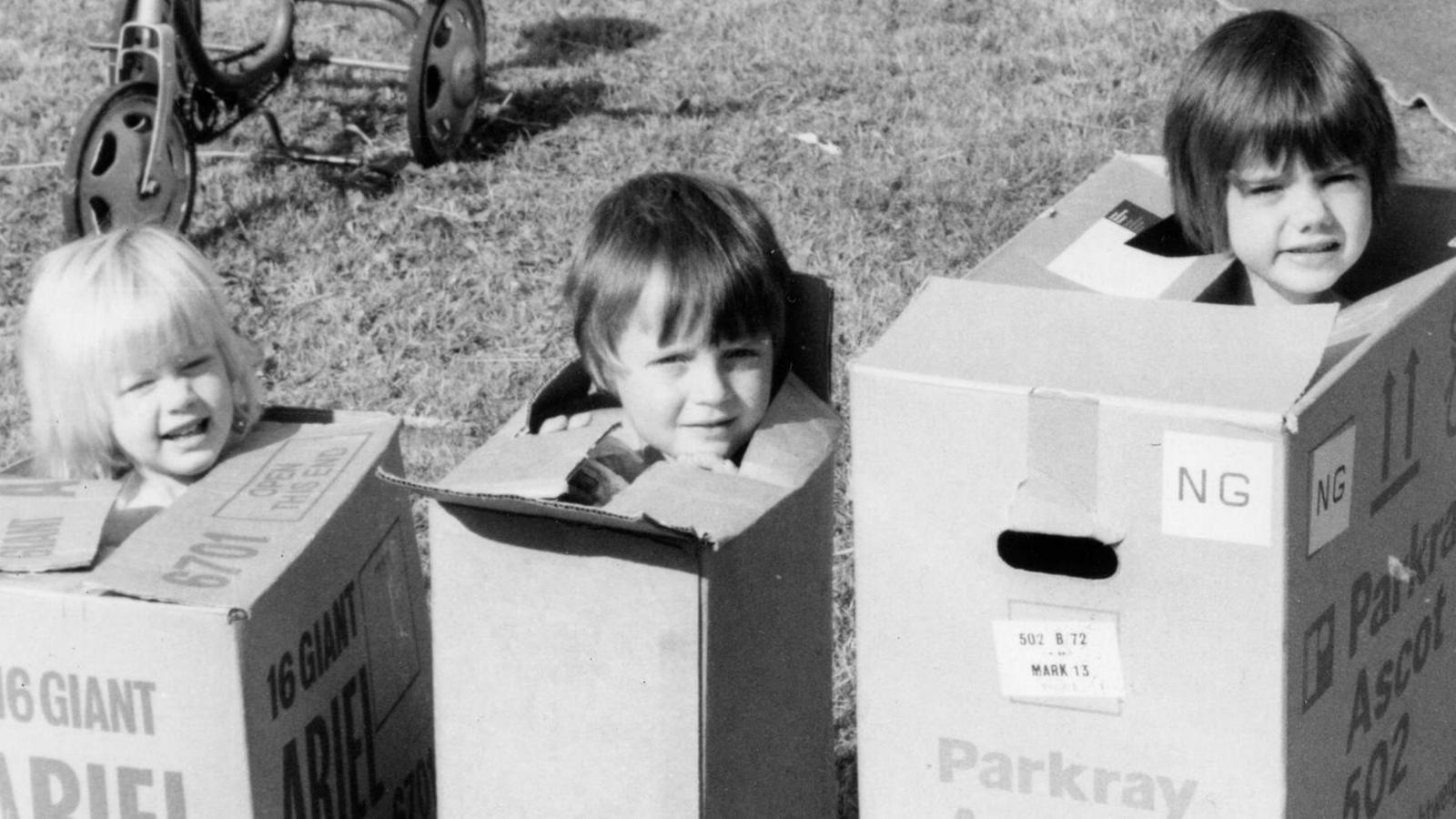 Marcus Rigby as a child playing with his sisters. 