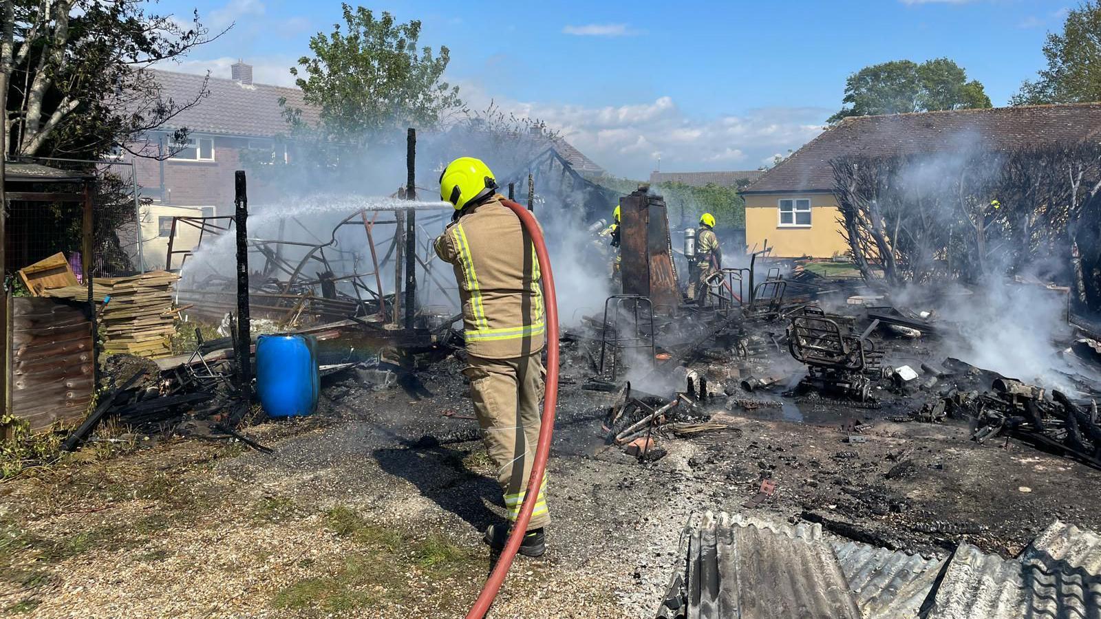 Firefighters working to extinguish the fire