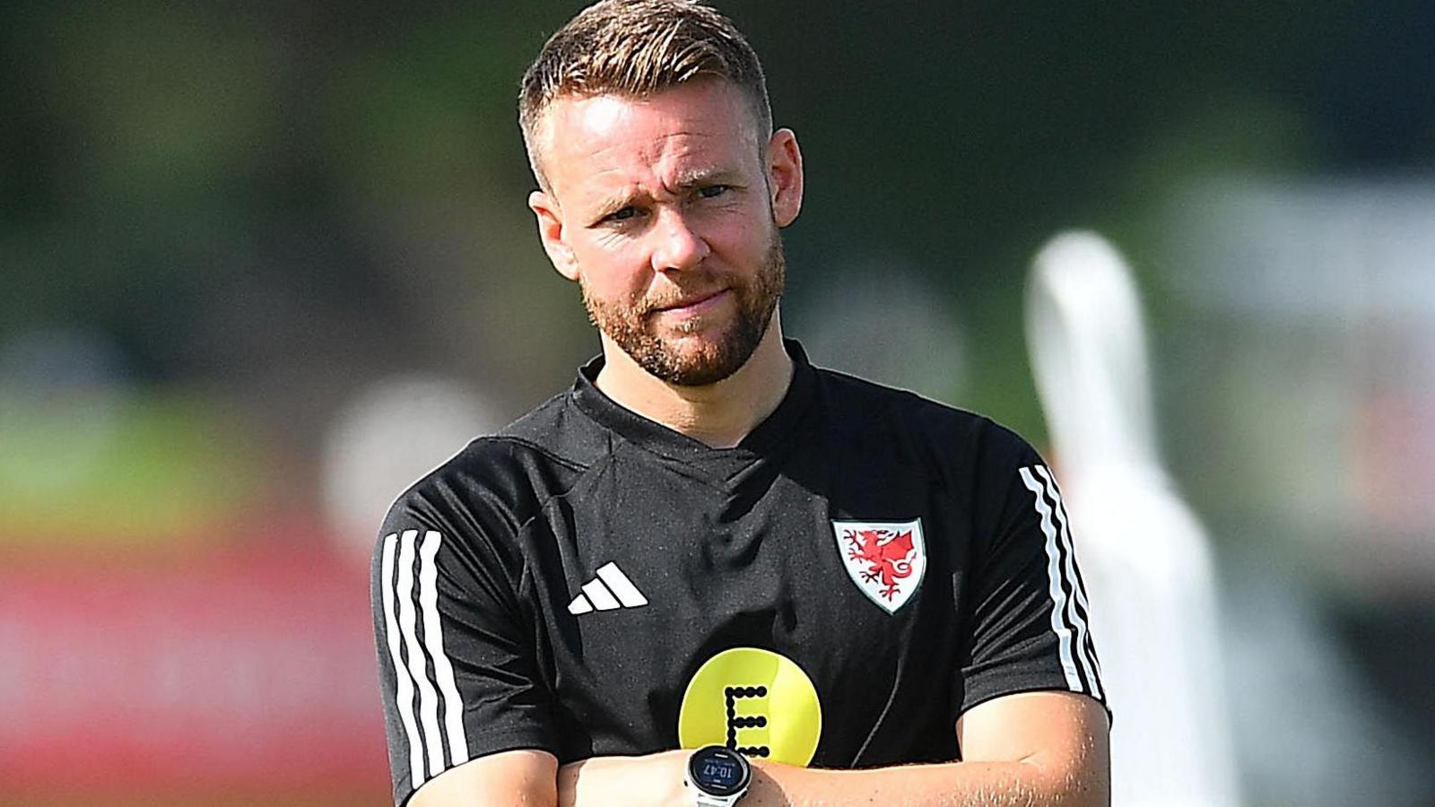 Chris Gunter oversees a Wales training session