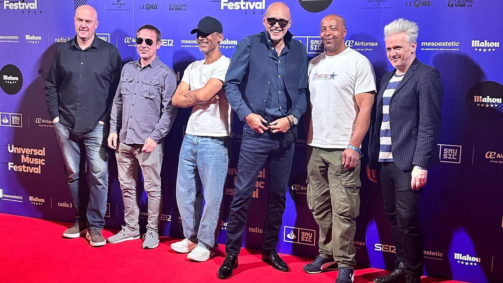 The Christians' bandmates stand together at an event in Madrid