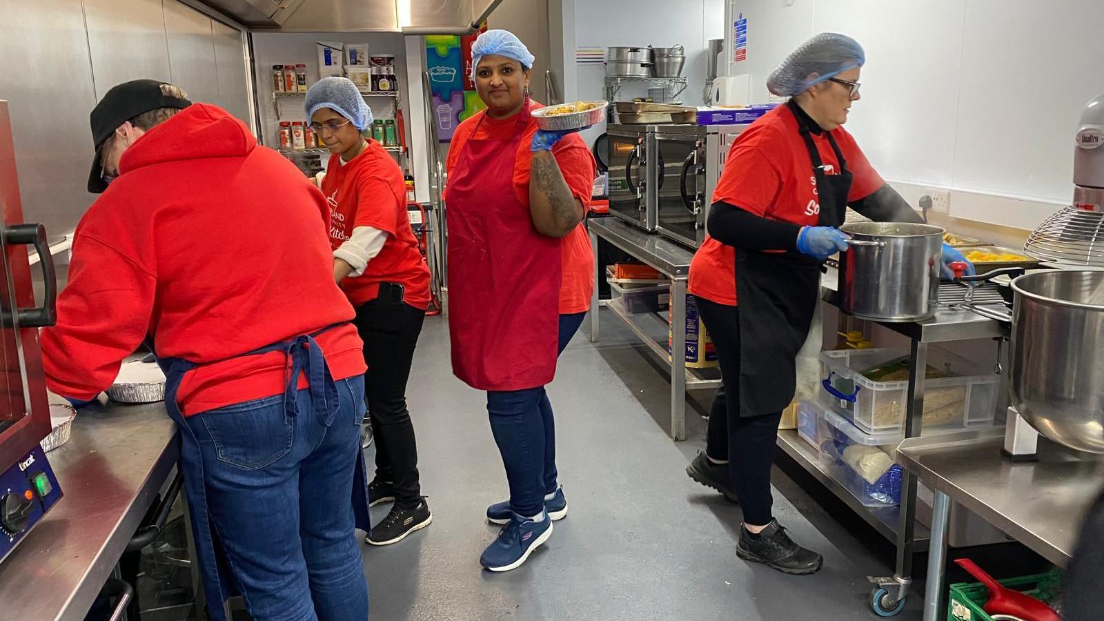 A group of people cooking meals 