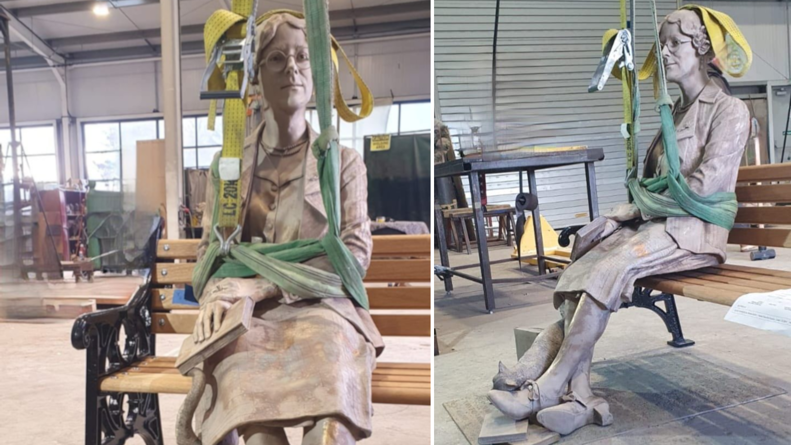 Two photos of the finished statue in a large warehouse workshop, taken from the front and from the side. The bronze statue of a woman is sitting on an iron and wood slatted bench. She is holding a closed book against her right leg and looking straight ahead, her ankles crossed and a cat rubbing its head on her shoe. Hoist straps are wrapped around the figure's waist.