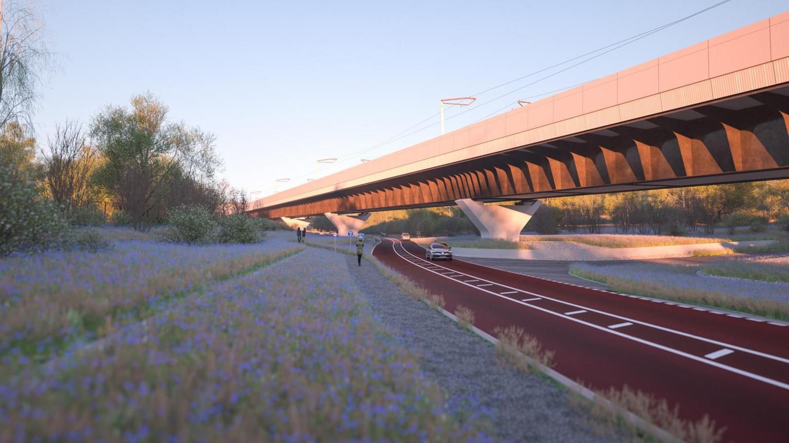 Artist's impression of HS2 Small Dean Viaduct A413 looking north. On the right is a the bridge resting on Y-shaped concrete pillars with a road beneath it. On the left is a field with flowers. There is a path alongside the road.  There are people on the path and cars on the road. 