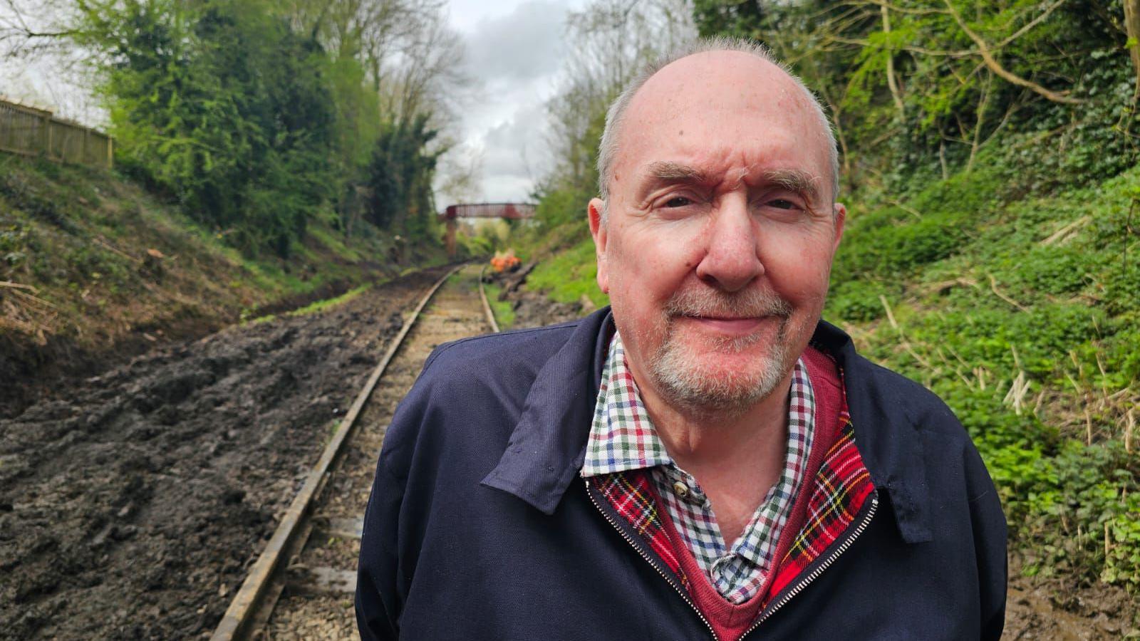 Tom Tait standing in front of the track 