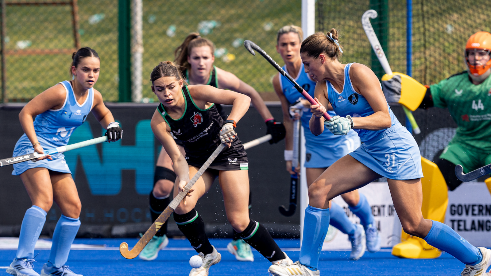 Maria Rodriguez shoots as she is closed down by Betsan Thomas