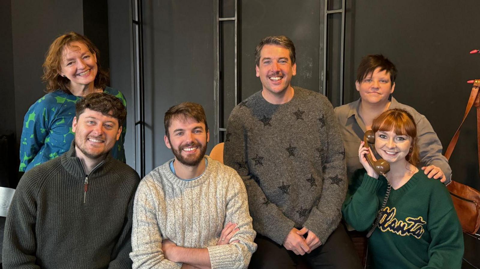 The cast of Callings - all grouped together for a photo on the set of their rehearsal stage