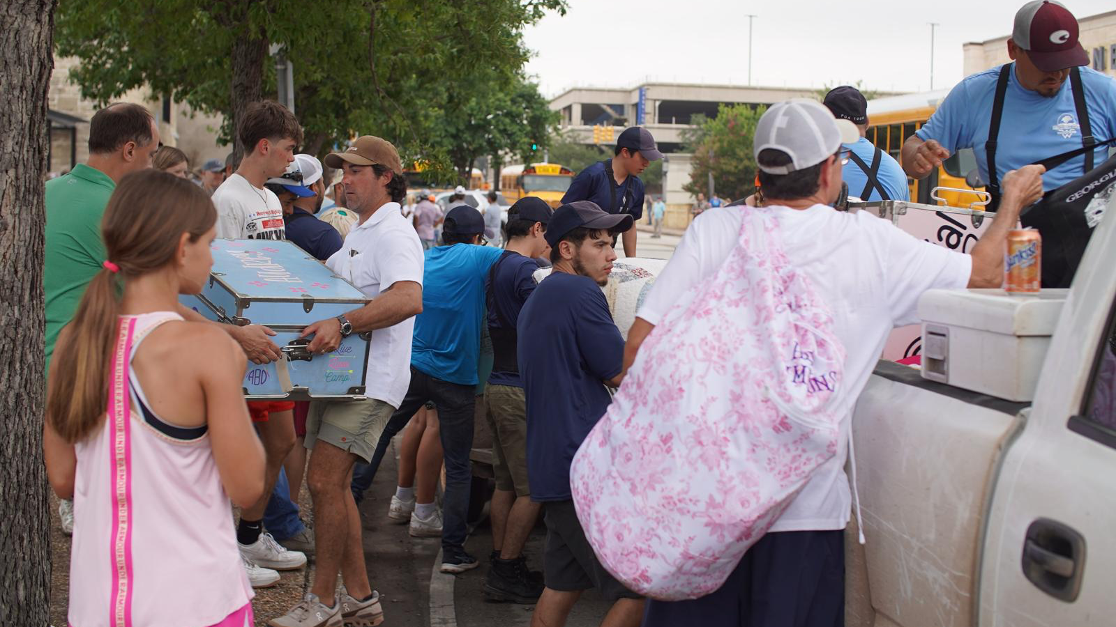 People in Texas collecting things from flooded areas