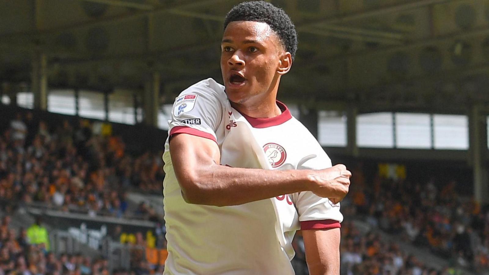 Fally Mayulu celebrates scoring on the opening day of last season