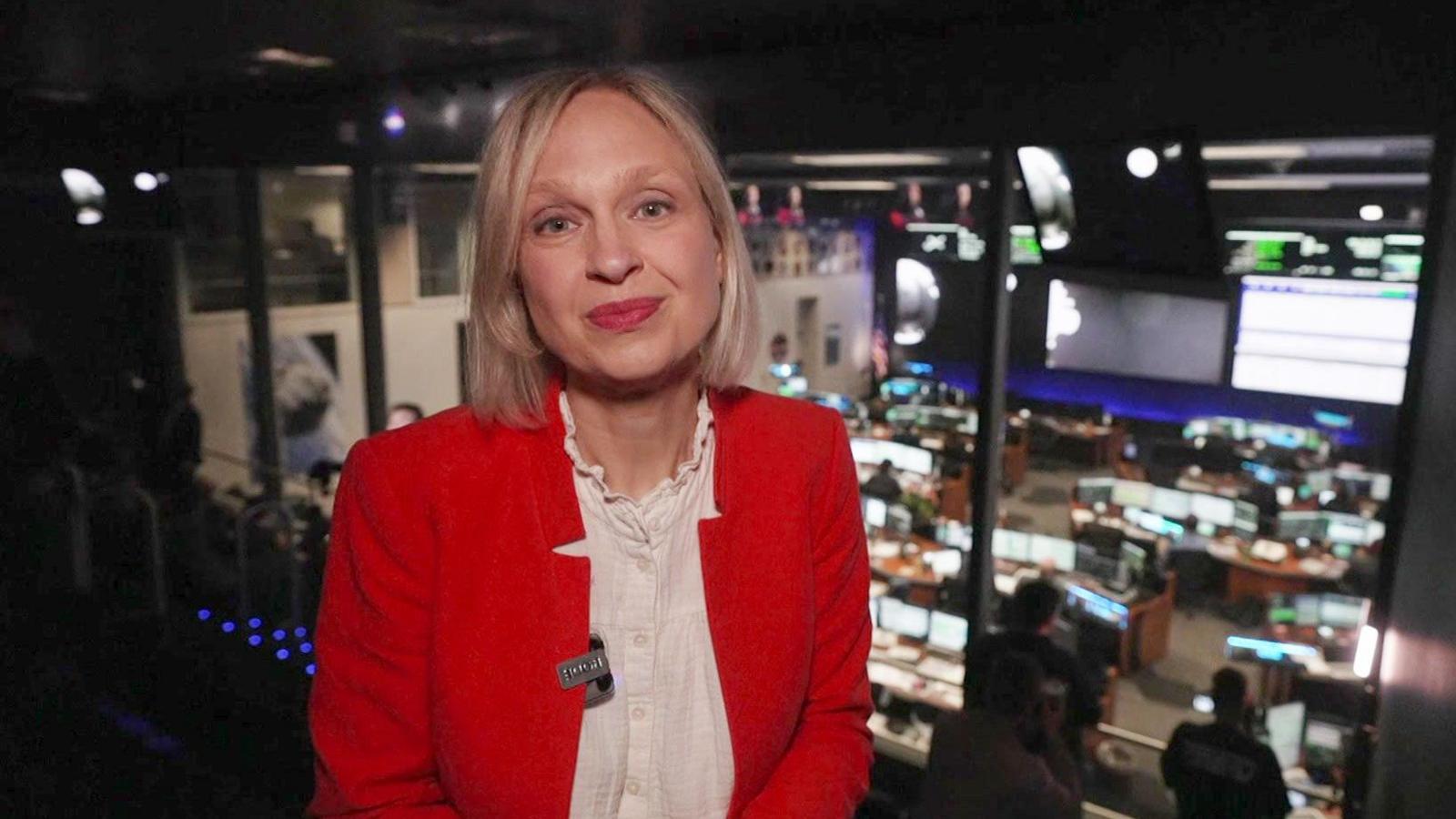 Rebecca standing in front of a mission control