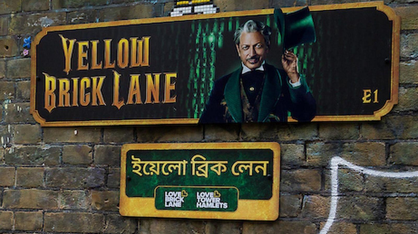 A "Wicked" themed street sign for Brick Lane, placed along the road 