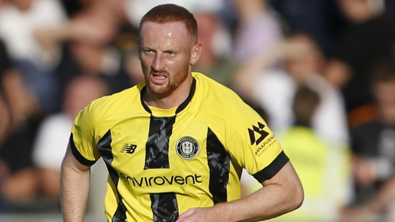 Liam Gibson in action for Harrogate Town