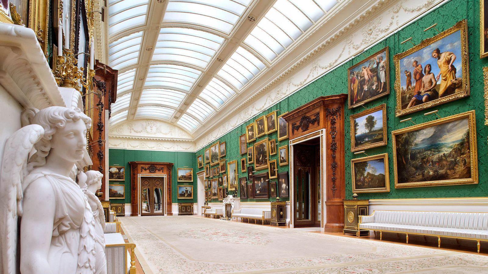 Buckingham Palace's Picture Gallery following its redisplay, with emerald-green silk wall hangings, updated lighting and paintings from the Royal Collection displayed along the walls.