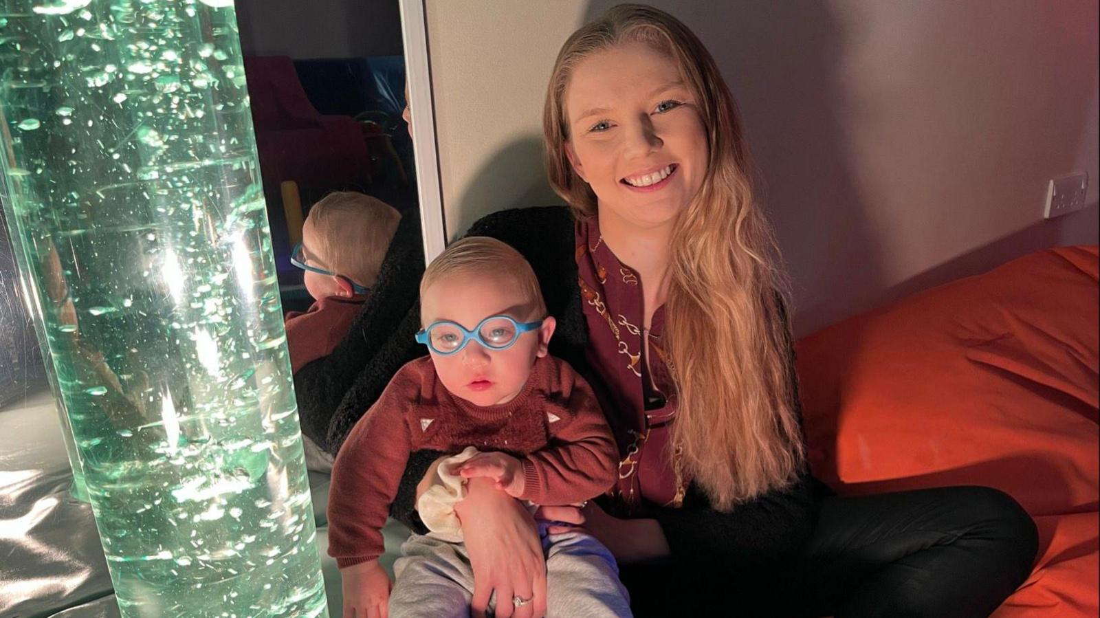Bethany Earl and her son Arthur sat on a beanbag enjoying the sensory room at SNAAP in Herne Bay