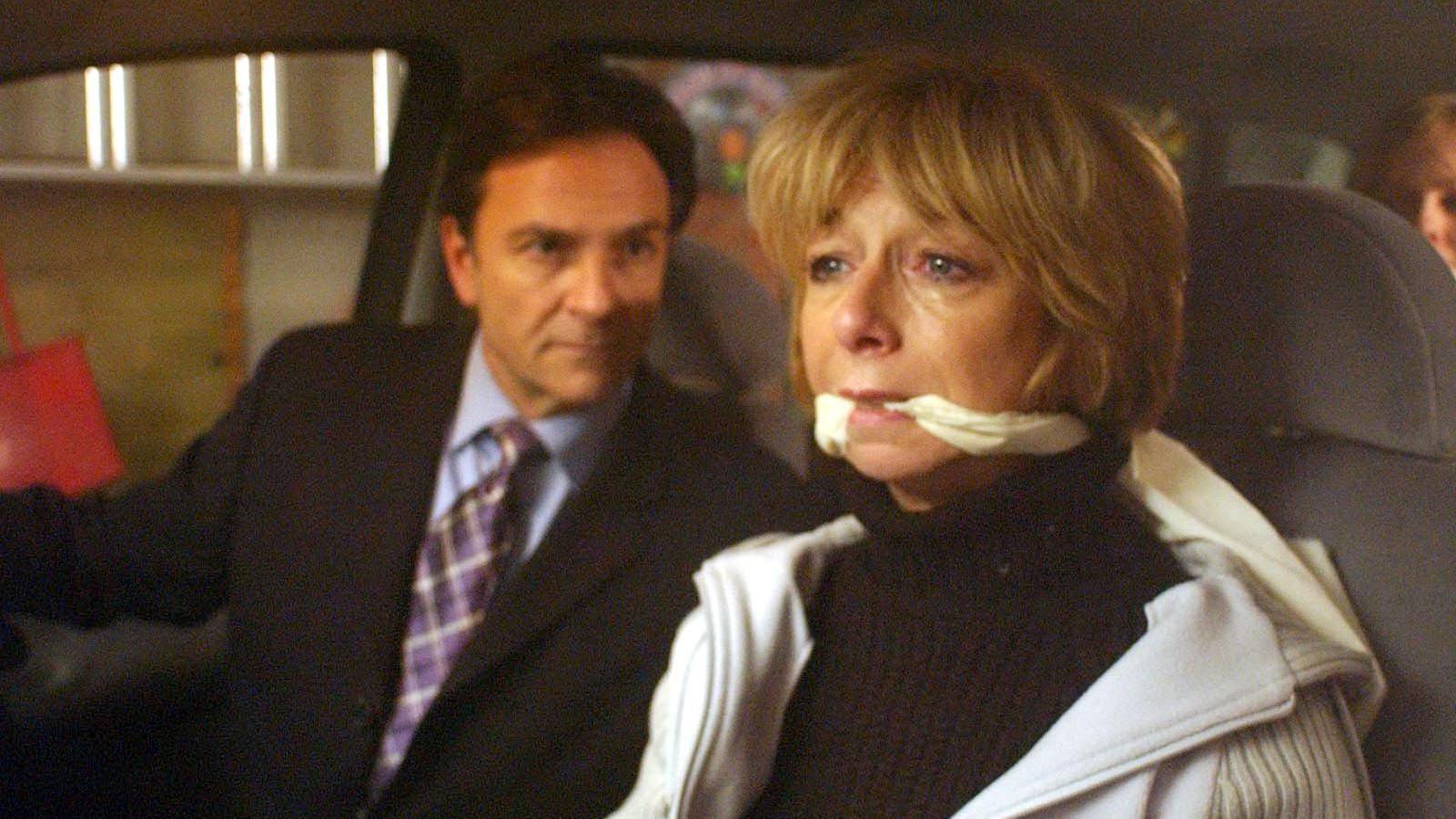 Gail looking frightened in a car while being kidnkapped along with her family by her third husband Richard Hillman