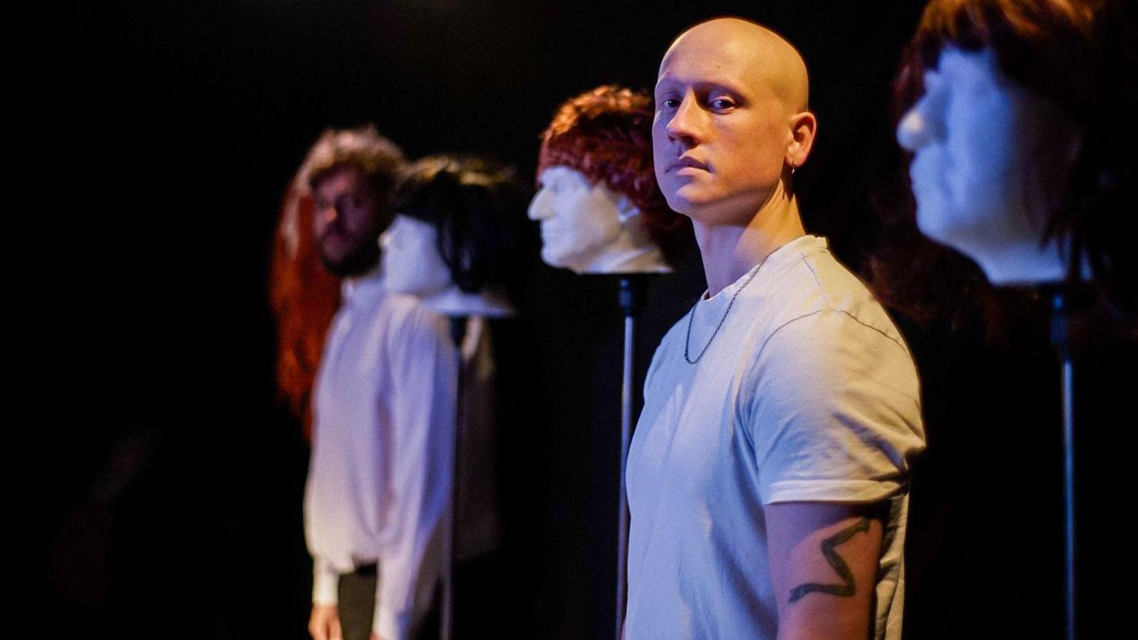 Actor and playright Sam McGregor poses on stage at a theatre in Northumberland ahead of performing his show Truly Madly Baldy