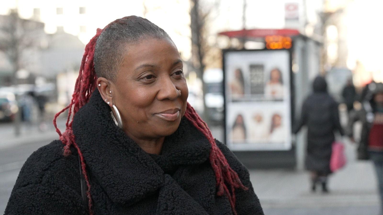 Donna Murray-Turner in a black coat standing on a busy street in Croydon 