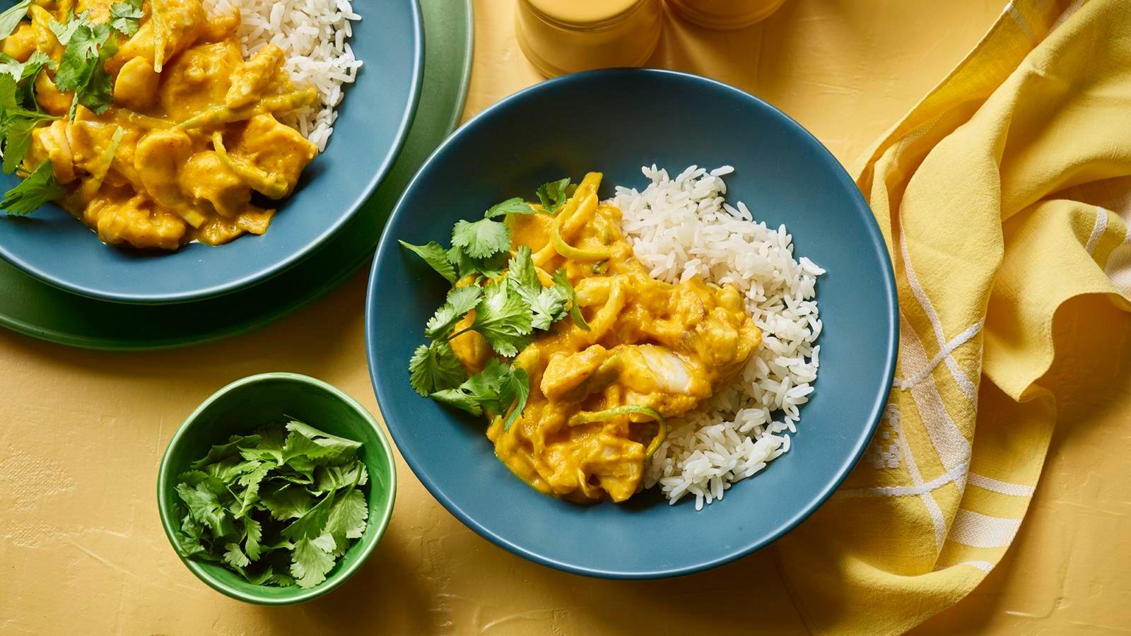 a cod and carrot curry with rice and coriander