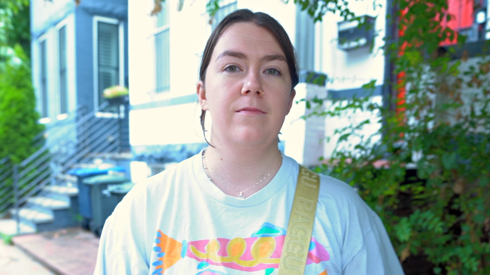 Contributor Winnie Litchfield looking into the camera wearing a white shirt and a neutral expression